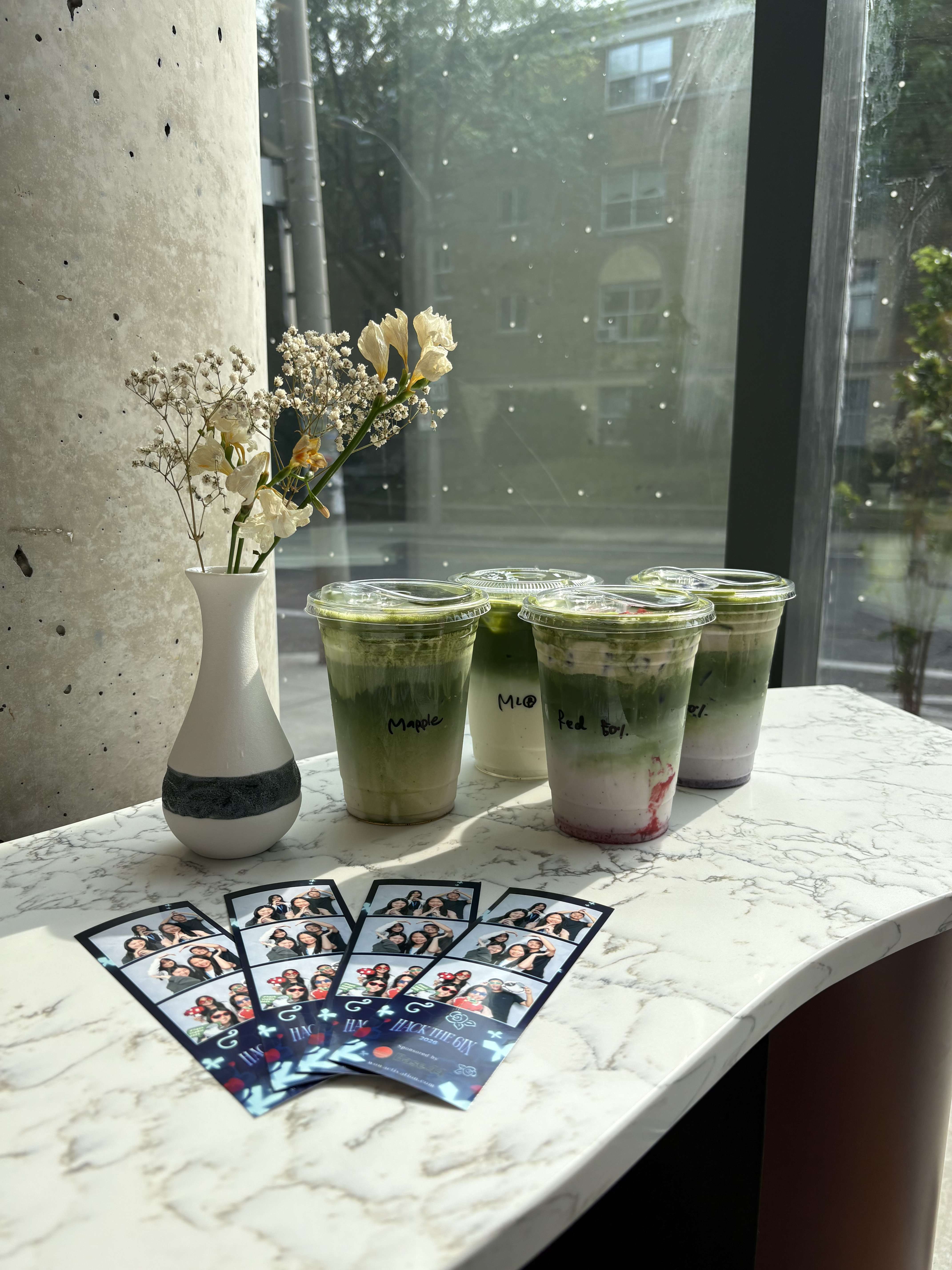 Four matcha drinks with flowers and photo strips