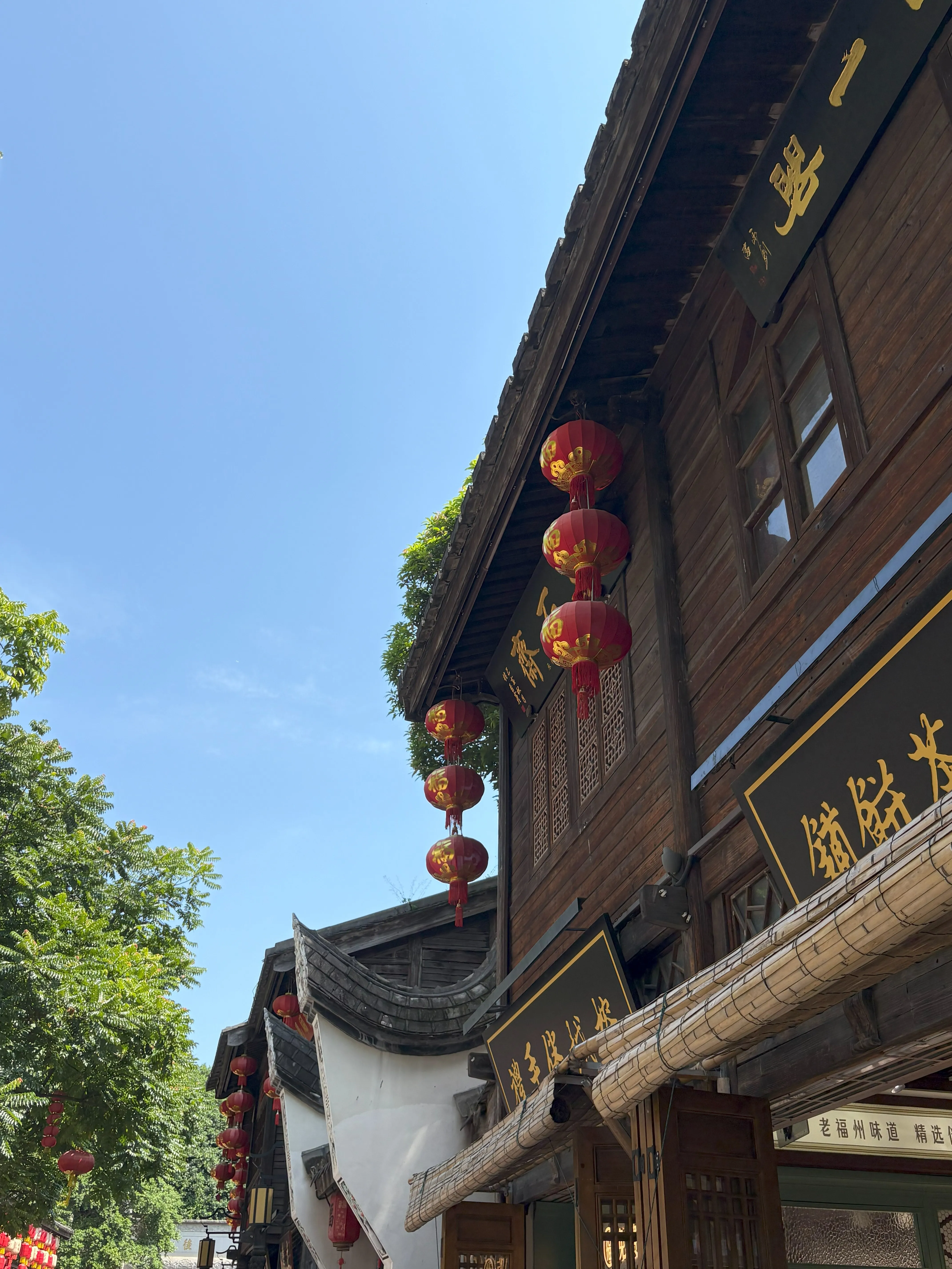Side of historical building with hanging lanterns
