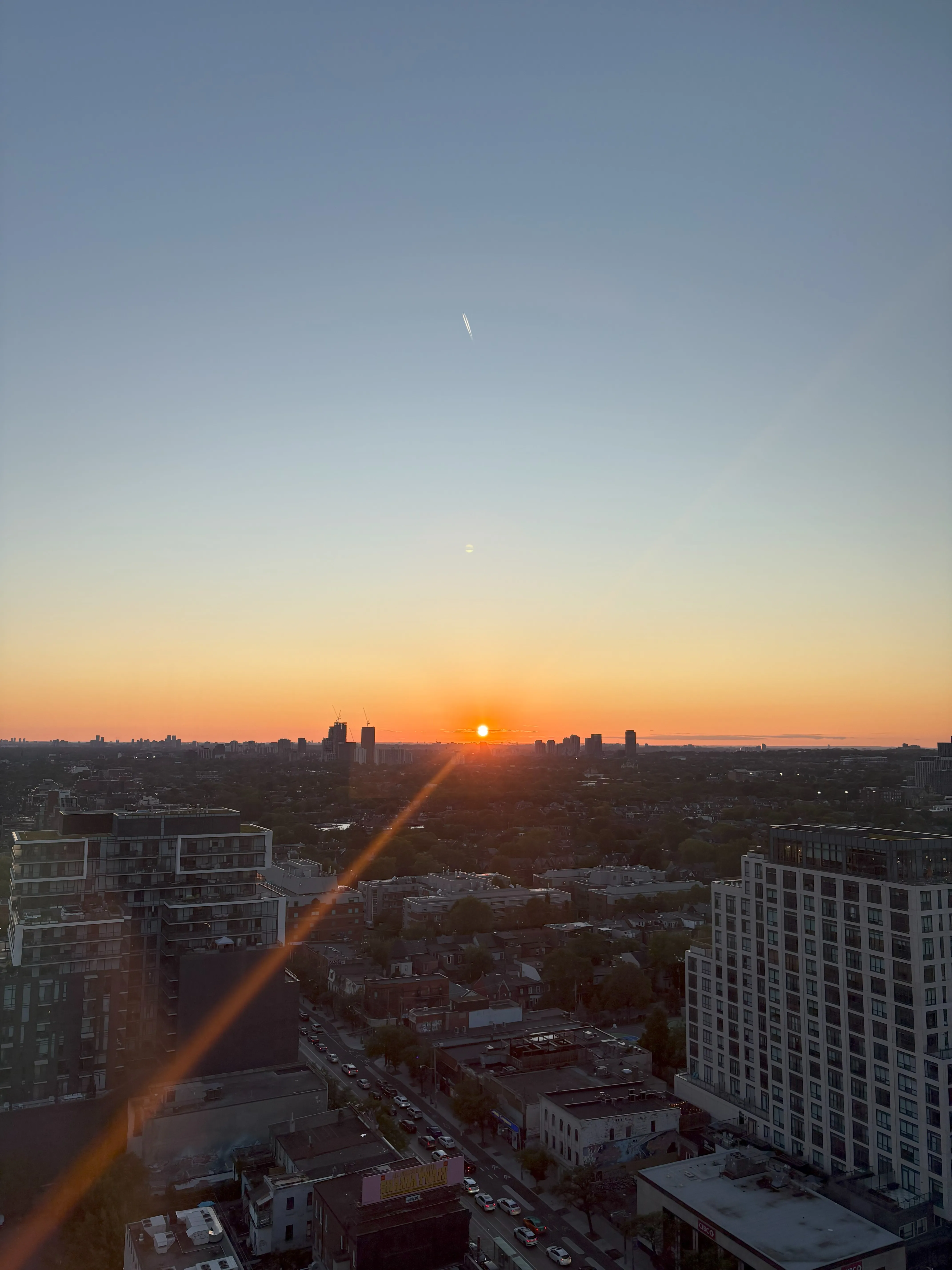 Blue and orange sunset above Toronto buildings