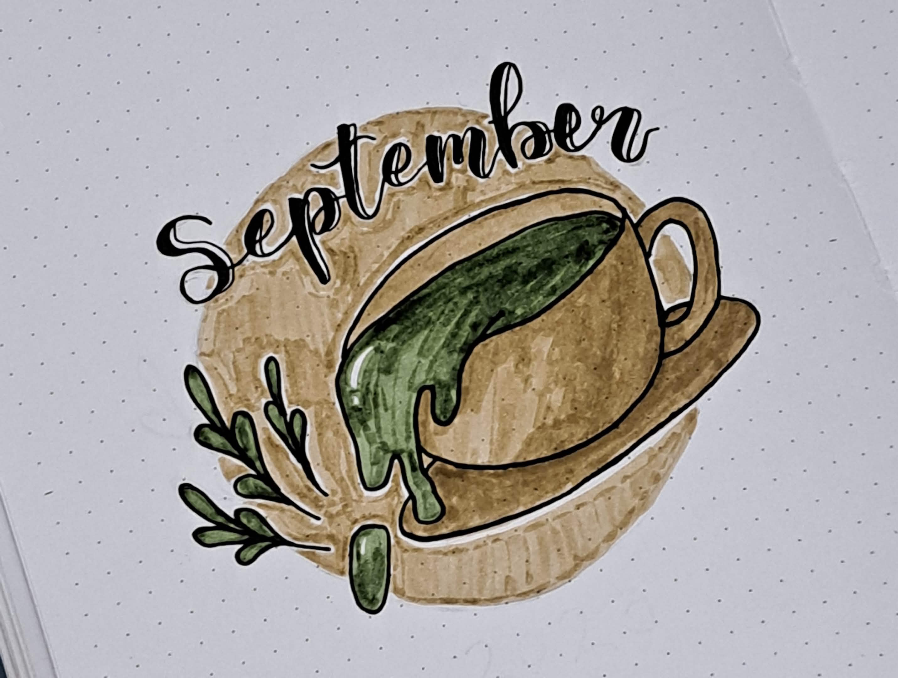Calligraphy of 'September' in a notebook